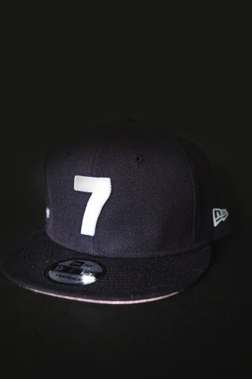 CMPD NEW ERA '7' NAVY/PINK BRIM SNAPBACK